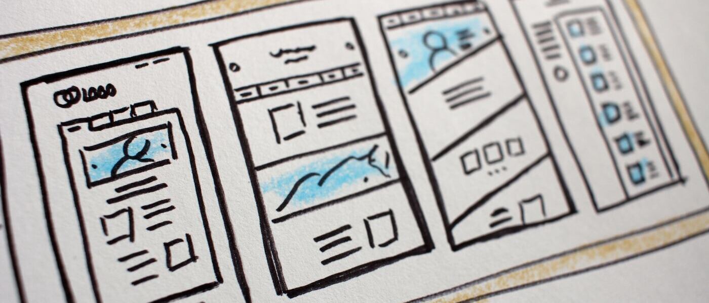 Designer Sketching User Interface Wireframes and Information Architecture